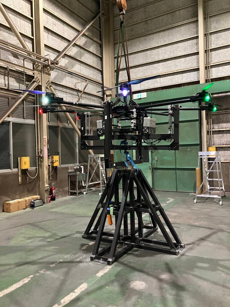 Large-scale drone testing setup in industrial environment, showing tethered drone evaluation and structural testing conditions for high payload UAV systems